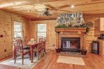 Eagle`s Lair dining area with wood burning fireplace. 